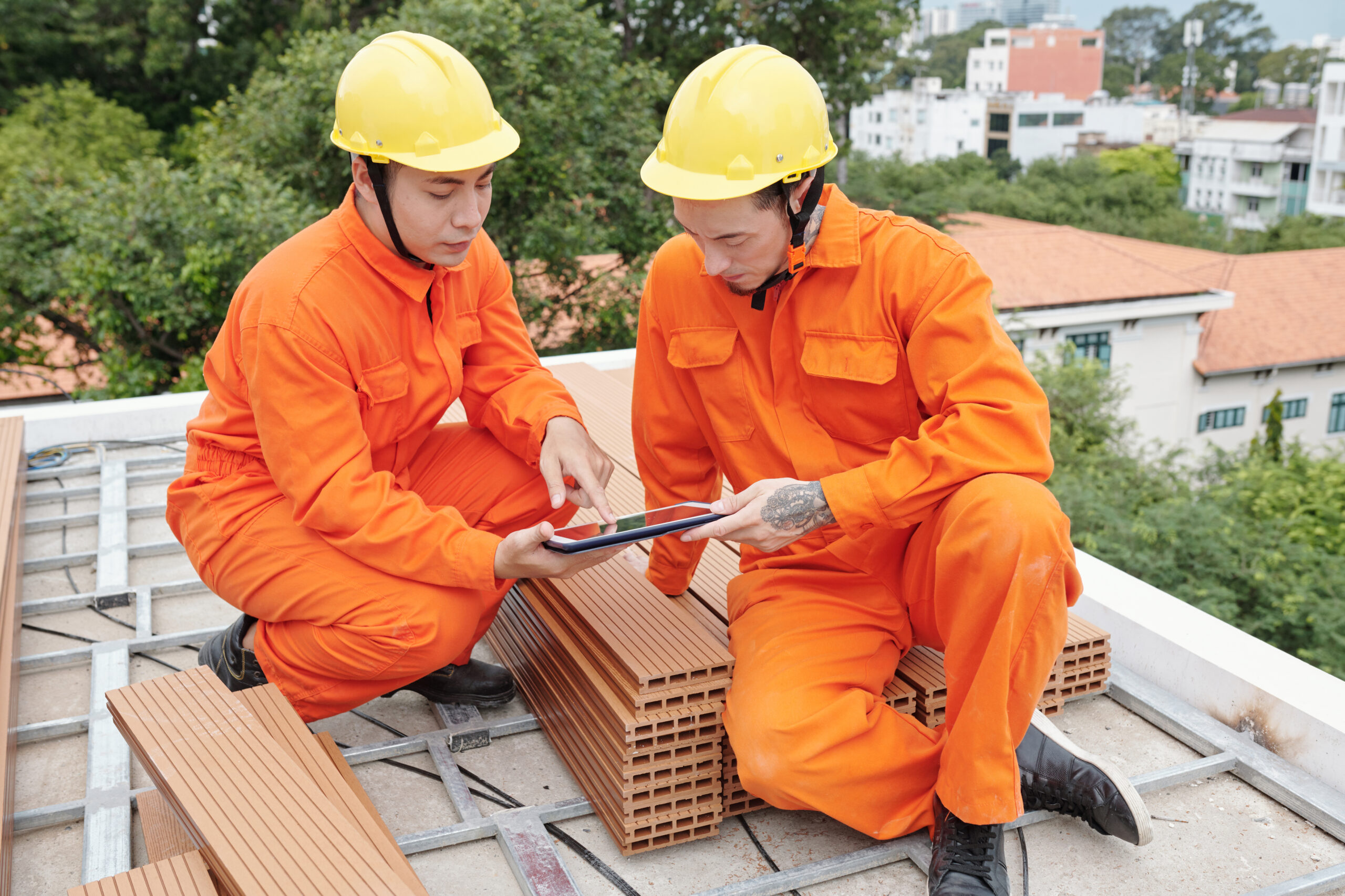 Roofing contractors discussing about the roofing details